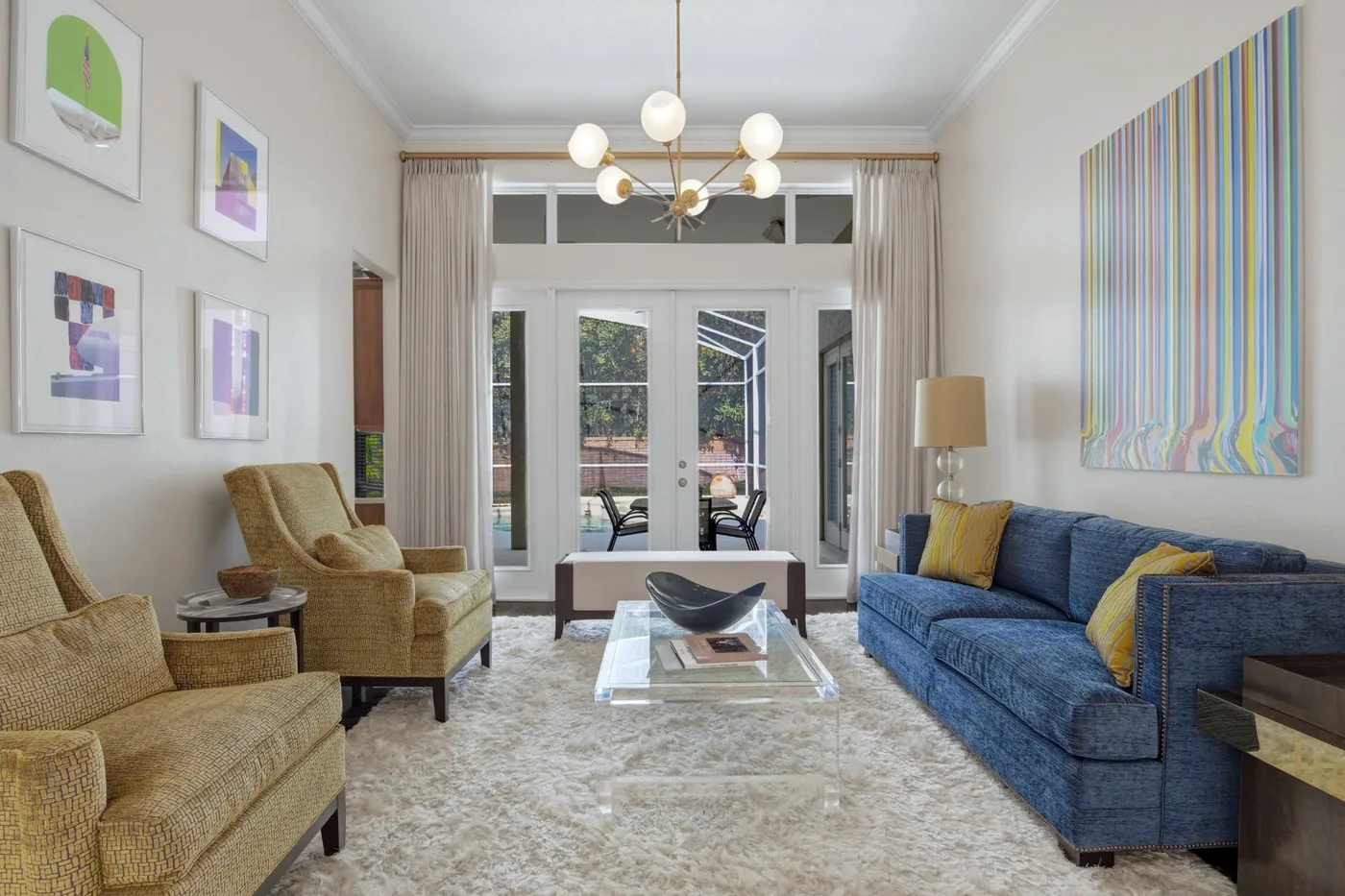 Luxury formal living room with high ceilings and French doors - professional real estate photography by REMIX, Boca Pointe Orlando Florida