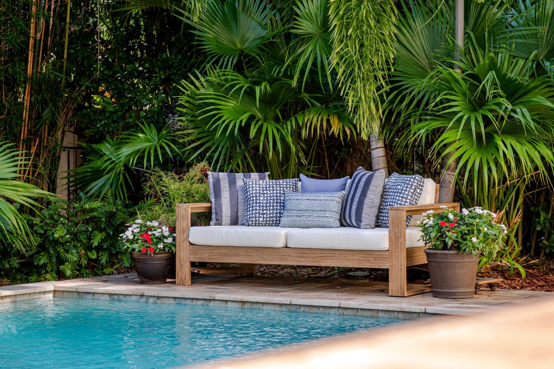 Luxury outdoor pool and seating area real estate photography by REMIX - Florida listing media showing resort-style backyard