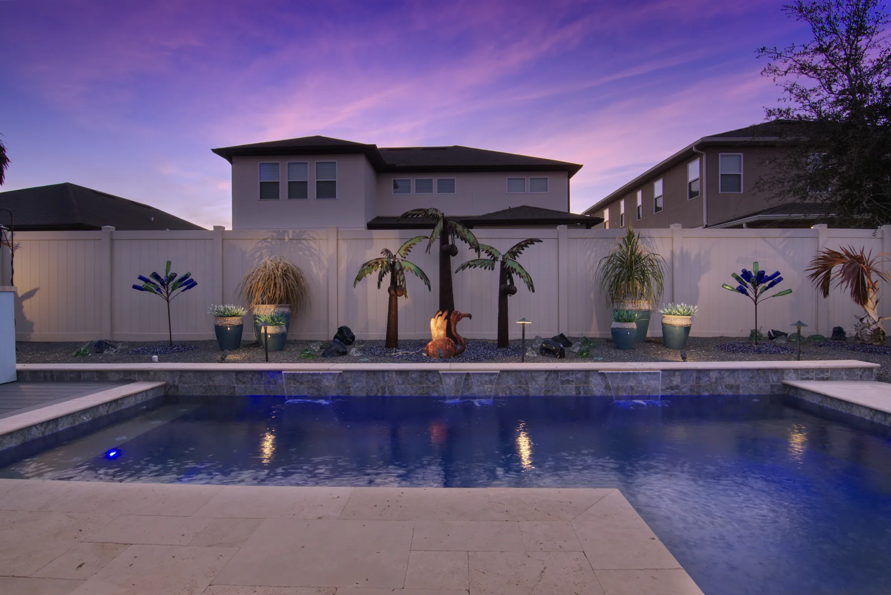 Twilight pool photography with dramatic purple dusk sky - real estate listing photo by REMIX, Orlando Florida